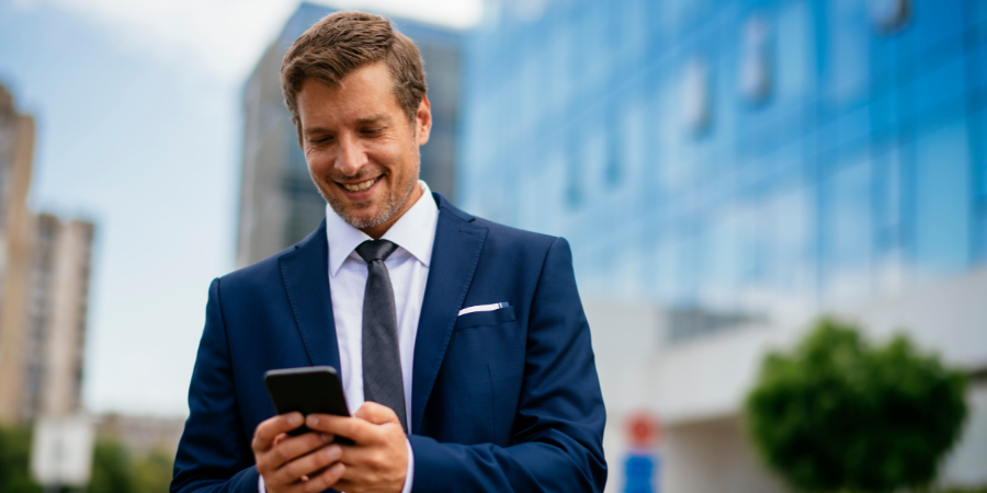 business-man-texting-on-cell-phone